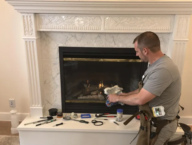 Southbury Chimney Sweep performing fireplace maintenance in Southbury, CT