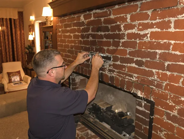 Southbury Chimney Sweep expert fixing a fireplace in Southbury, CT